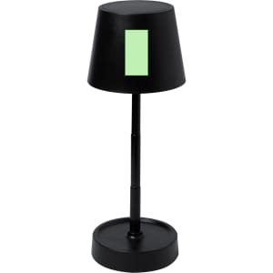 A black lamp with a cylindrical base and a conical shade featuring a green accent. It has a sleek, modern design.