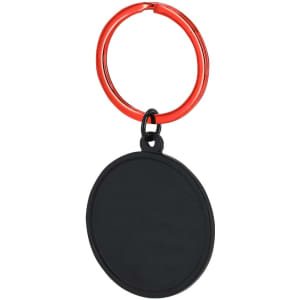 A black keyring with a red metal loop, featuring a circular, flat surface.