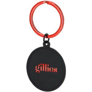A keyring featuring a round black pendant with a red keyring attachment, displaying a logo in red.