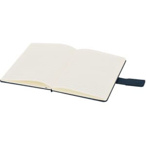 An open notepad with lined pages and a dark blue cover, featuring a ribbon bookmark.