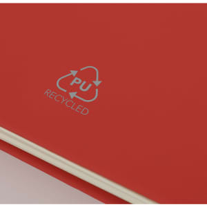 A red notebook with a cream interior and a recycling logo on the cover.