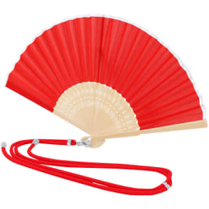 A red hand fan with a cream handle and decorative elements, featuring a red strap for easy carrying.