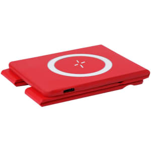 A red wireless charger with a circular design and a USB port, featuring a smooth surface and a compact shape.