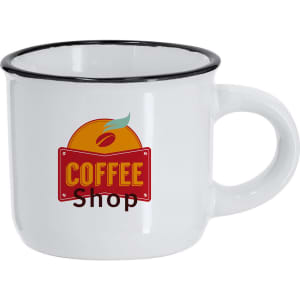 A white enamel coffee mug with a black rim and a logo featuring an orange and the words “Coffee Shop.”