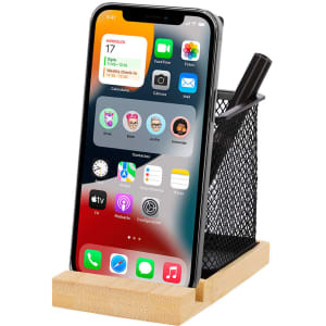 A bamboo and black mesh pencil holder featuring a smartphone, surrounded by pens and other office supplies.
