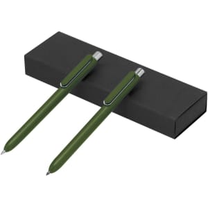 A set of two green pens nestled in a black gift box, featuring sleek designs and silver accents.