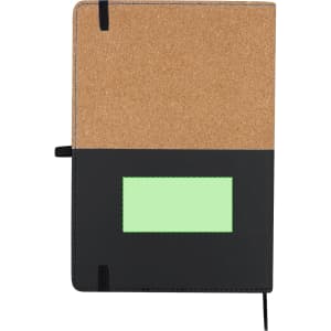 A notepad featuring a cork cover and a black lower section, with a branding logo at the front and a green label space.