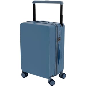 A blue wheeled bag with a retractable handle and four wheels, featuring a smooth exterior and a logo.