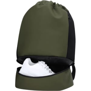 A green backpack with a black base and a compartment holding a white shoe. It features a logo on the front.