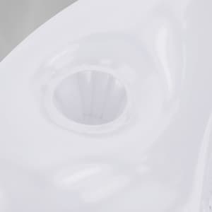 A white Kokoro Armchair featuring a smooth, modern design with a central opening.