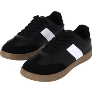 A pair of black trainers with white accents and a gum sole, featuring laces and a logo.