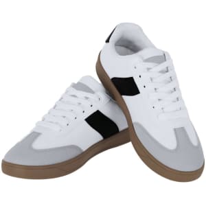 A pair of white and grey trainers with black accents and a gum sole, featuring laces and a logo.