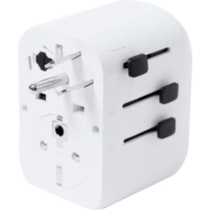 A white travel plug adapter featuring multiple port options for various countries and a logo on the side.