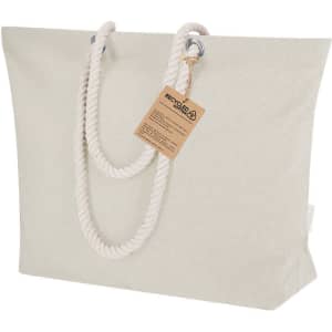 A large beige tote bag with thick rope handles and a tag, featuring a simple and elegant design.