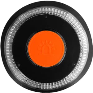 A round emergency light in black and orange, featuring a clear lens and a central orange button with a logo.