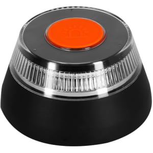 A black emergency light with a clear, ribbed base and an orange button on top. It features a logo on the front.
