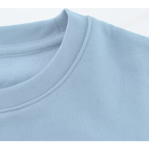 A light blue sweatshirt featuring a round neckline and a logo on the front. Soft fabric texture is visible.