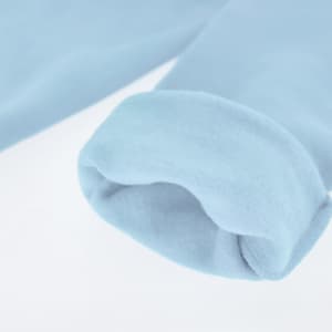 A light blue sweatshirt featuring a rolled cuff detail, soft fabric, and an attached logo.
