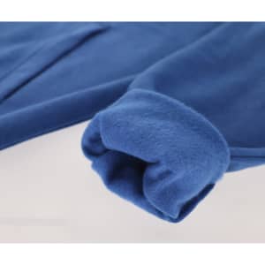 A blue sweatshirt with a soft texture, featuring a cuffed sleeve and a pocket. It has a logo on it.