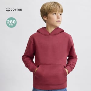 A red kids' sweatshirt with a hood and front pocket, made of 280 GSM cotton. Features a small logo.