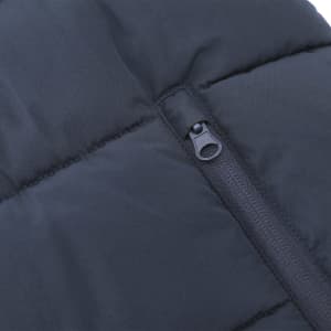 A black puffer jacket featuring a zippered pocket, showcasing a textured fabric design.