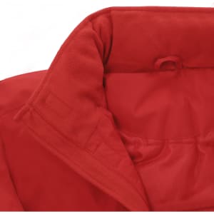 A close-up of the collar and interior lining of a red puffer jacket. It features a soft texture and a logo.