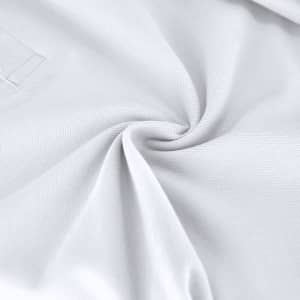 A white polo shirt made from soft fabric, featuring a logo on the chest area.