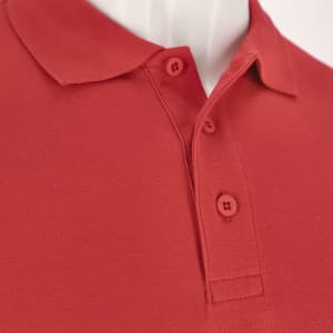A close-up view of a red polo shirt featuring a classic collar and button detail, with a logo present.