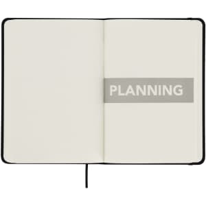 A notepad with a black cover and blank pages, featuring a prominent "PLANNING" section in the centre.