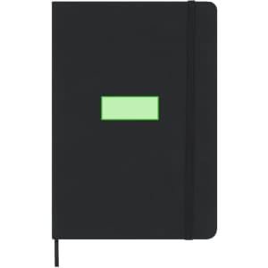A black notepad with a green rectangular patch on the cover, featuring an elastic band closure and a ribbon bookmark.