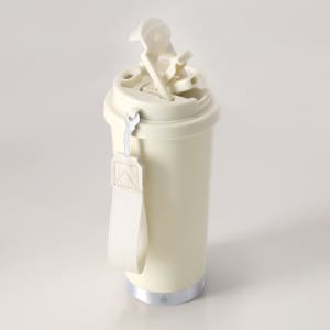 A drink bottle in cream with a silver base, featuring a lid and a strap. It includes a logo.