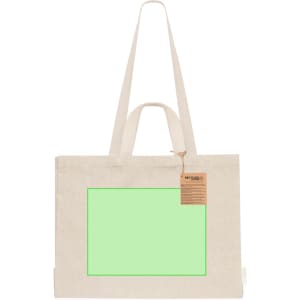 A light beige tote bag with long handles, featuring a blank green panel and a tag.