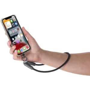 A black charging cable with a holder, attached to a smartphone in a hand.