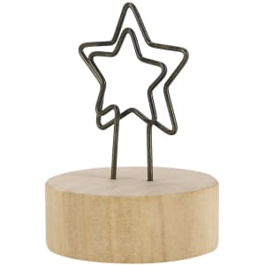 A star-shaped holder with a wood base, designed to support notes or photos, in a natural finish.