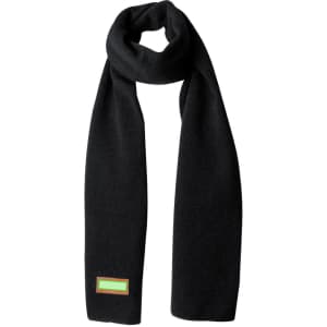 A black scarf featuring a small logo tag in bright colours. Ideal for enhancing winter outfits.