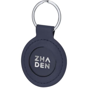 A navy blue keyring with a circular design and a silver logo. It features a metal keychain attachment.