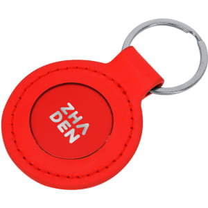 A red rubber keyring with a metal keychain and a logo in the centre.
