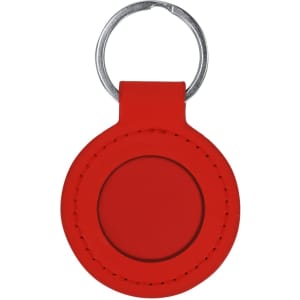 A red circular keyring with a silver keychain attachment. It features a smooth surface with stitching detail.