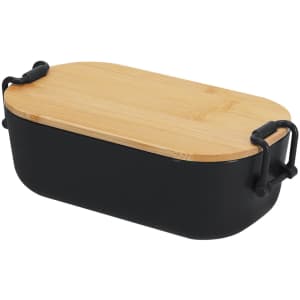 A black lunch box with a bamboo lid and ergonomic handles. Suitable for carrying food or snacks.