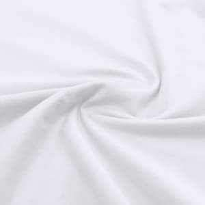 A close-up of white fabric, showcasing the smooth texture and softness of the material.