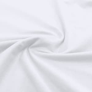 A white cotton fabric displaying a smooth, twisted texture. The material appears soft and lightweight.