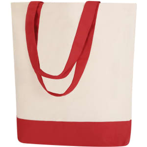 A cream tote bag with red fabric handles and a red bottom section. The bag features a logo.