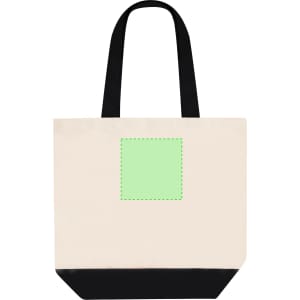 A tote bag in cream with a black base and contrasting green square outline. It features black shoulder straps and a logo.