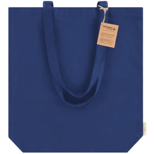 A navy tote bag with long straps and a tag attached, featuring a simple, minimalist design.