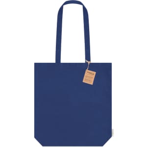 A navy blue tote bag with two shoulder straps and a tag attached, featuring a simple design and a logo.