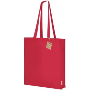 A red tote bag with long handles and a tag attached, featuring a simple design and a logo.