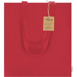 A red tote bag with two handles, made from organic cotton, featuring a tag attached.