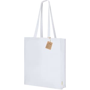 A white tote bag with long handles and a tag attached, featuring a simple design and a logo.