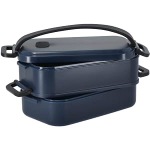 A navy blue Curibox lunch box with two stacked compartments and a black handle. It features a simple design and has a logo.