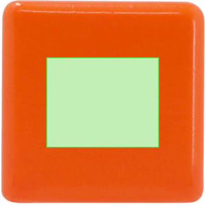 An orange stress shape featuring a small green square in the centre. The product has a smooth, shiny finish.